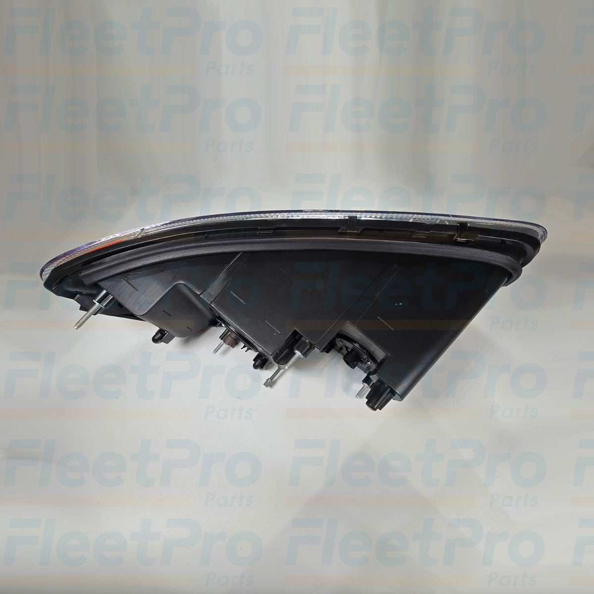 Bottom angle of Mack 888-5503 Passanger Side Headlight with mounting brackets visible