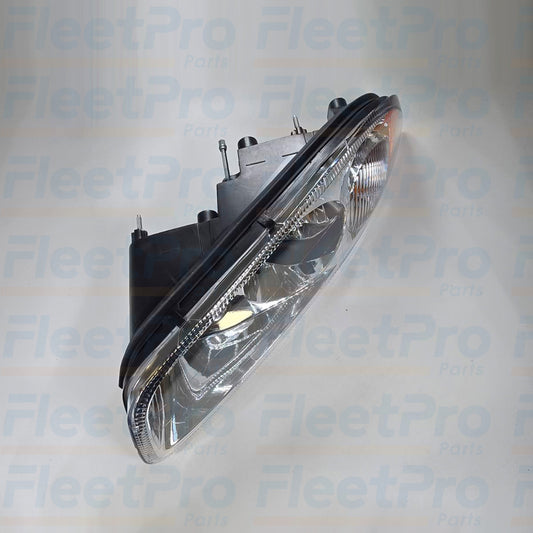 Side view of Mack 888-5504 headlight showing housing and lens details