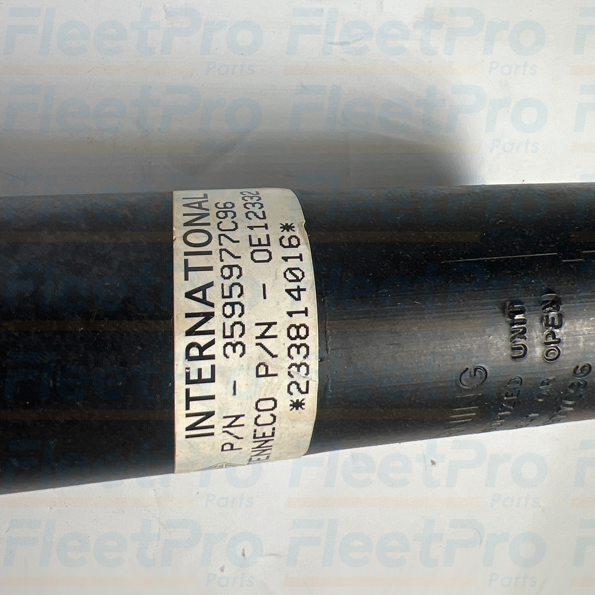 Top mount view of International cab air shock 3595977C96 with hardware connection