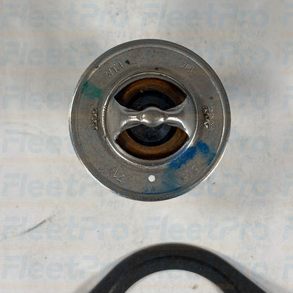 Close-up view of stainless steel bypass valve and wax-pellet actuator on Carrier 25-34309-01