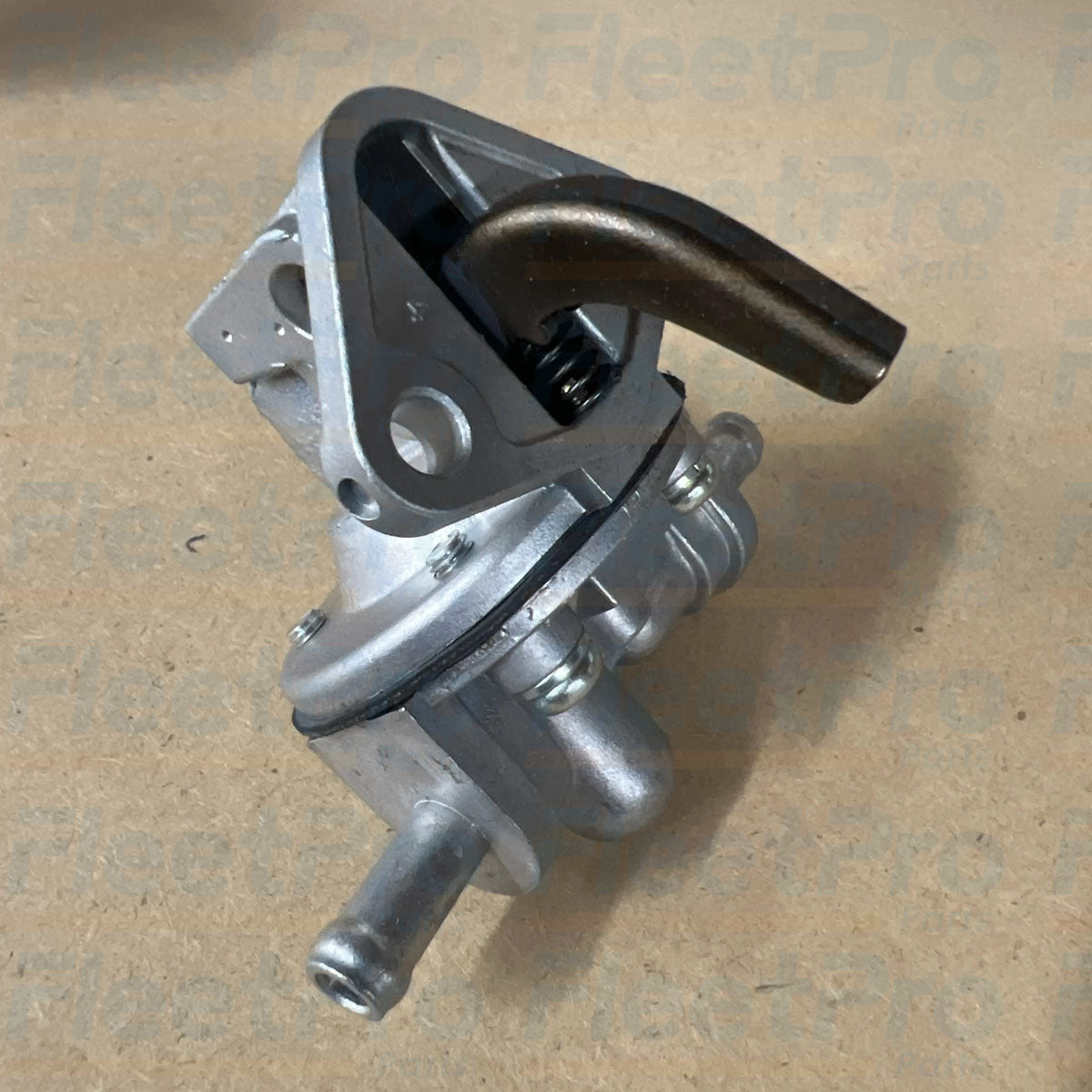 Close-up view of fuel inlet and outlet hose barbs on Carrier 30-377-01K pump