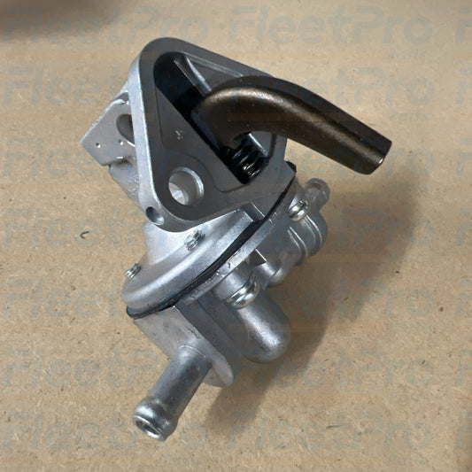 Close-up view of fuel inlet and outlet hose barbs on Carrier 30-377-01K pump
