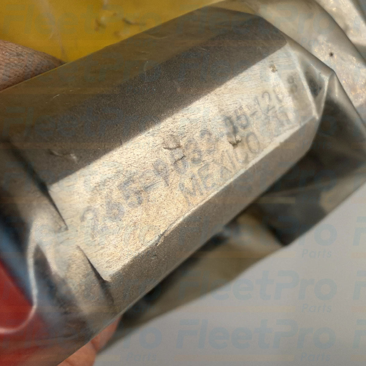 Close-up view of precision magnetic pickup probe tip on Caterpillar 265-9033 speed sensor