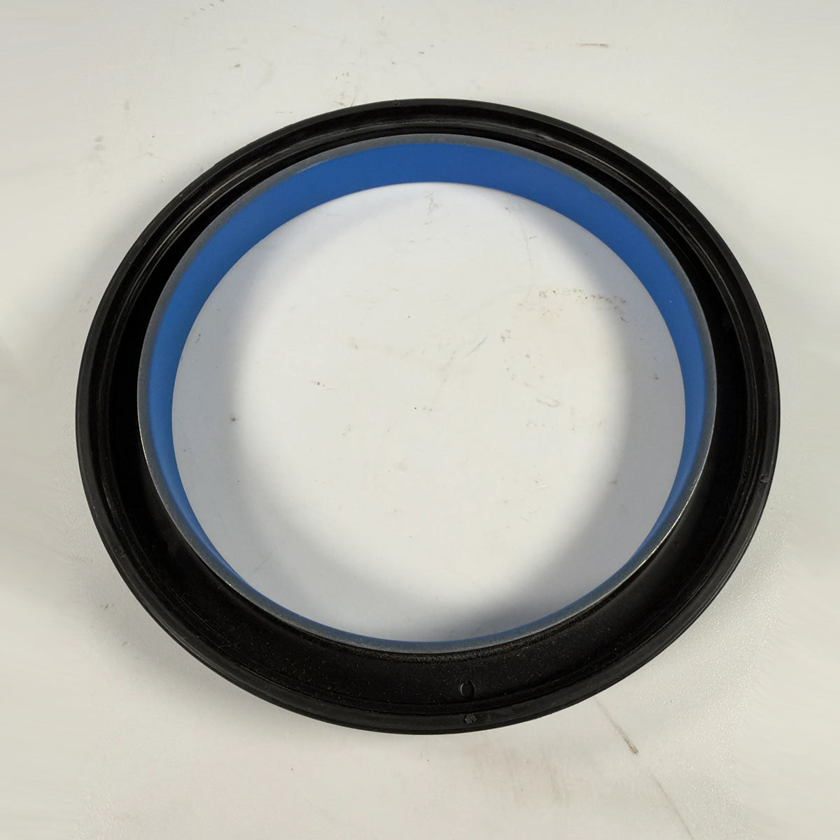 Close-up view of internal fluoroelastomer sealing lip and stainless steel garter spring on DDE 23518355