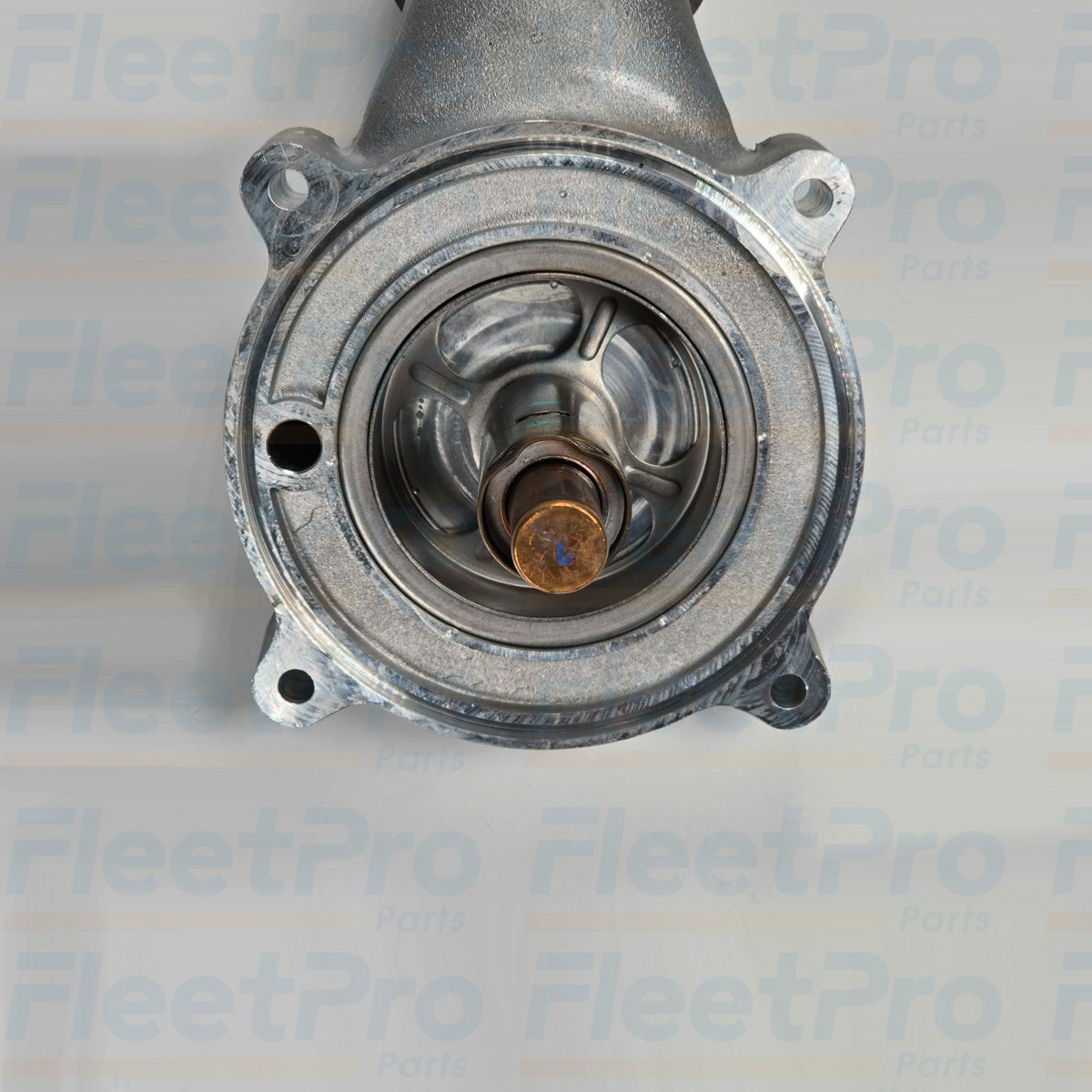 Close-up of Detroit Diesel A4722004115 thermostat housing and steel tubing materials