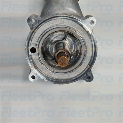 Close-up of Detroit Diesel A4722004115 thermostat housing and steel tubing materials