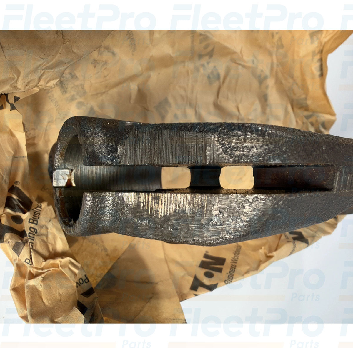 CNC-machined cross-shaft engagement bore detail on open box Eaton 3525689C2 clutch fork