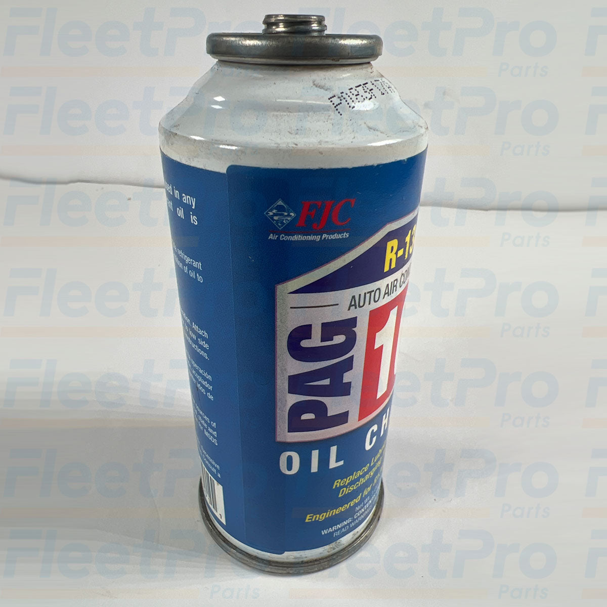 Product specification label detail showing 2 oz PAG oil and 1 oz R-134a charge composition on FJC 9143