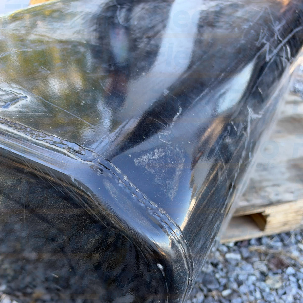 Close-up view of cosmetic surface dent and scratch condition detail on International 1682659C92 fuel tank