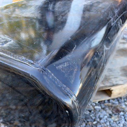 Close-up view of cosmetic surface dent and scratch condition detail on International 1682659C92 fuel tank