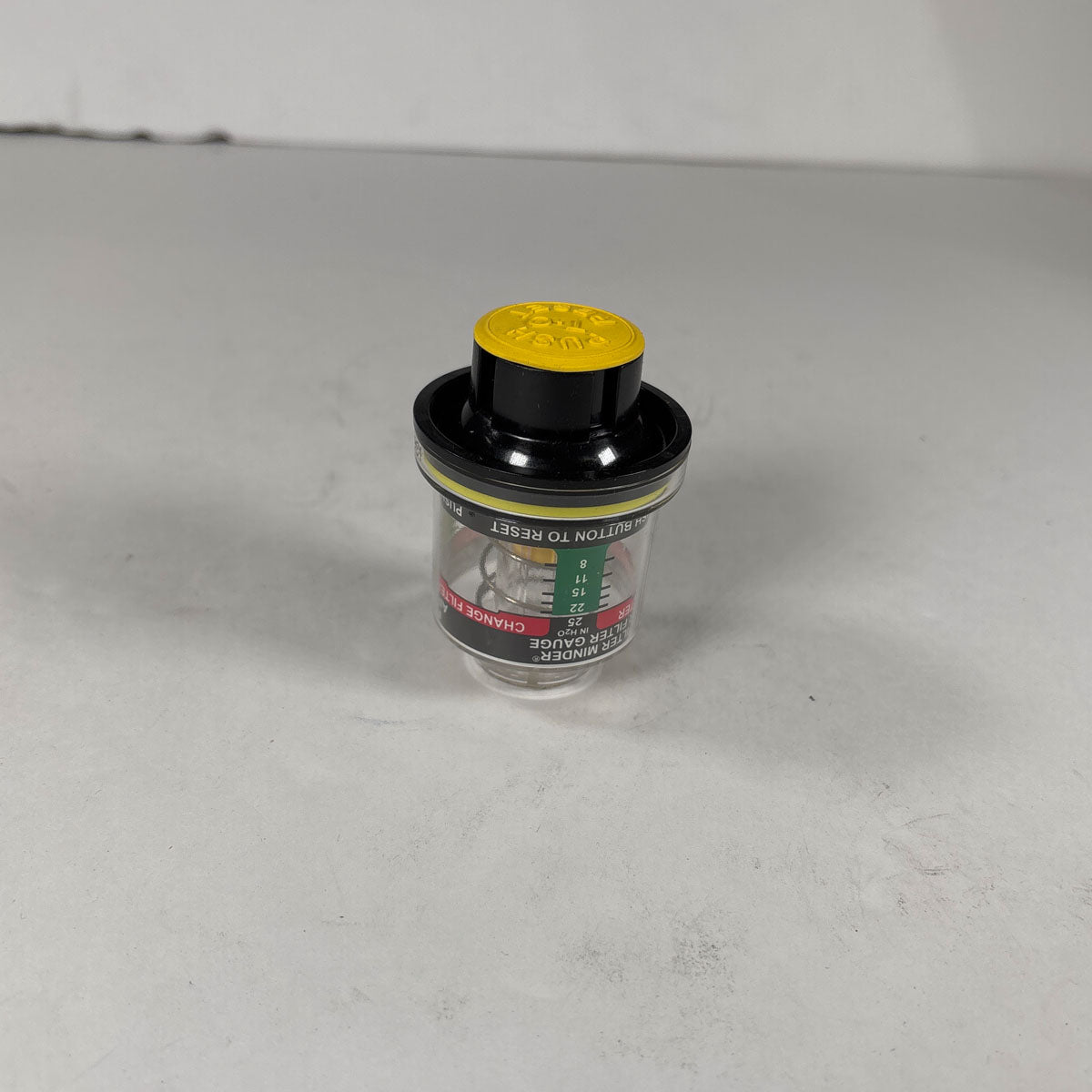 Threaded brass mounting fitting and suction port detail on International 539245C1 indicator gauge