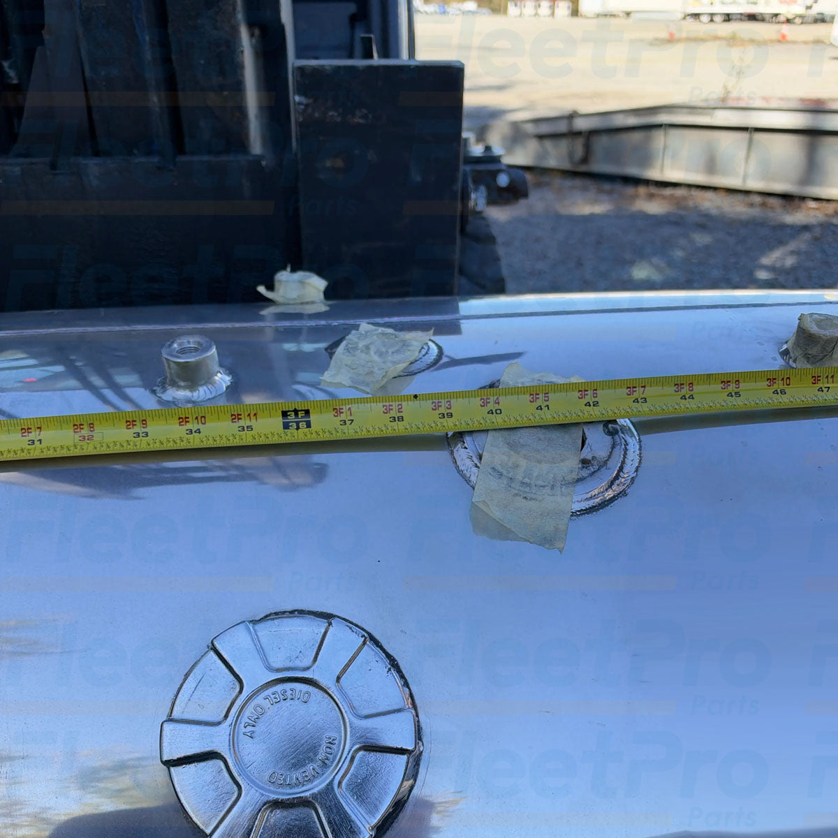 Threaded aluminum fuel filler neck and heavy-duty cap interface detail on International 6115003C91 fuel tank