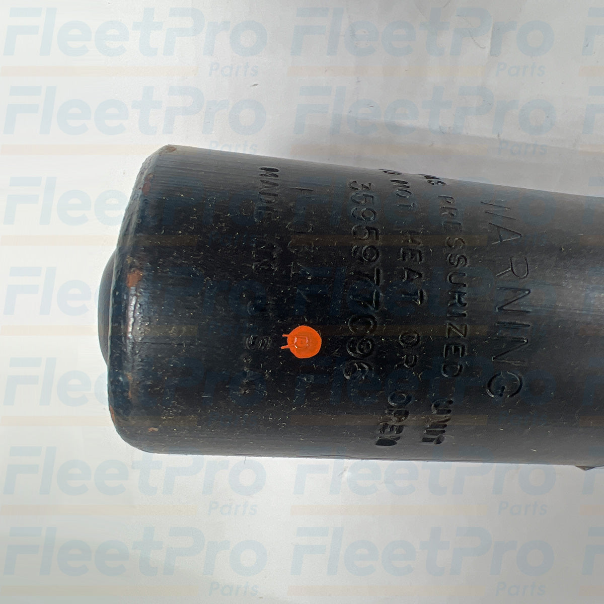 Side angle view of International OE12332 cab air suspension shock absorber