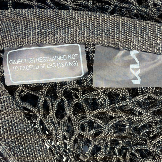 Genuine Kia R5F17-AU601 OEM cargo net installed in vehicle rear trunk compartment view