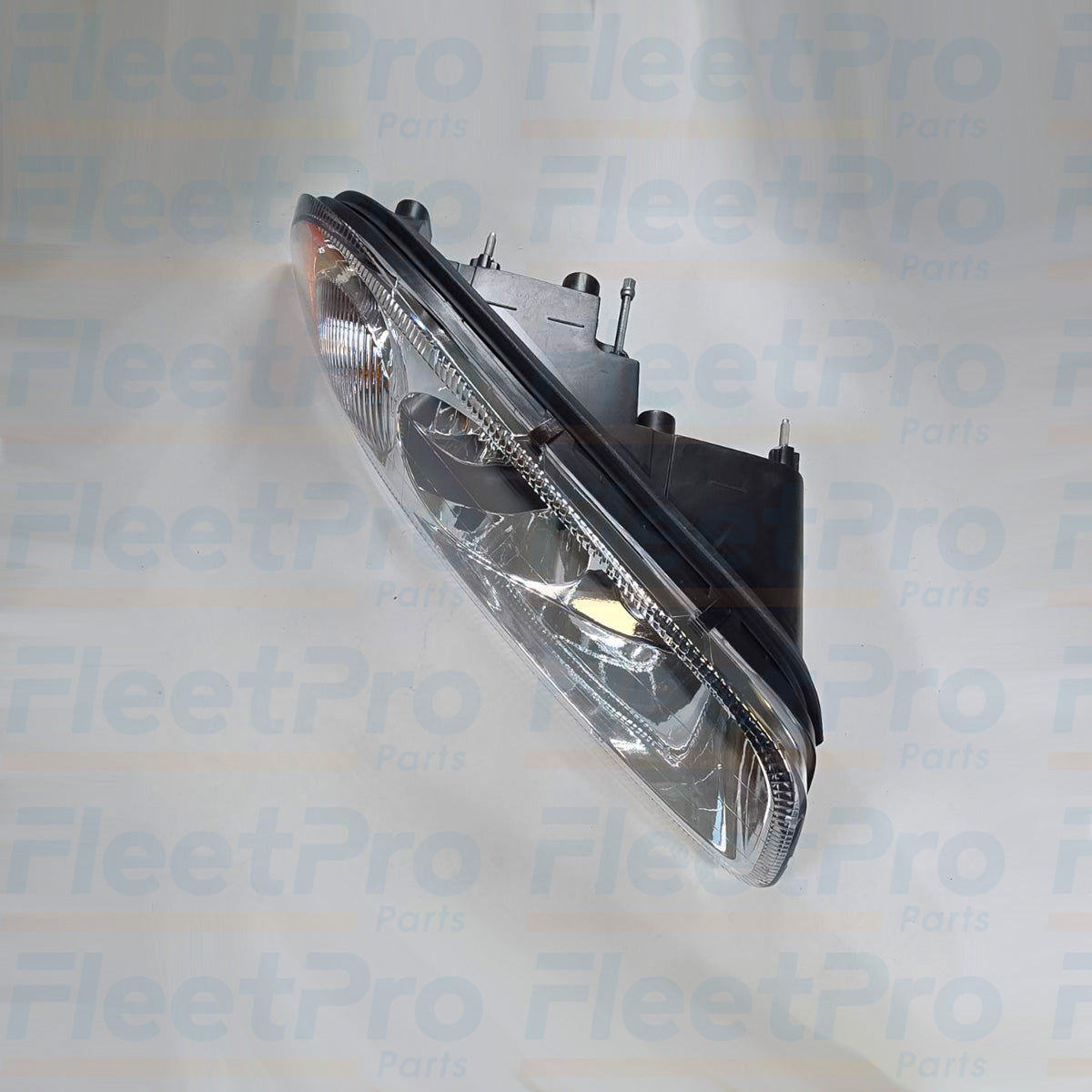 Side view of Mack 888-5503 headlight showing housing and lens details