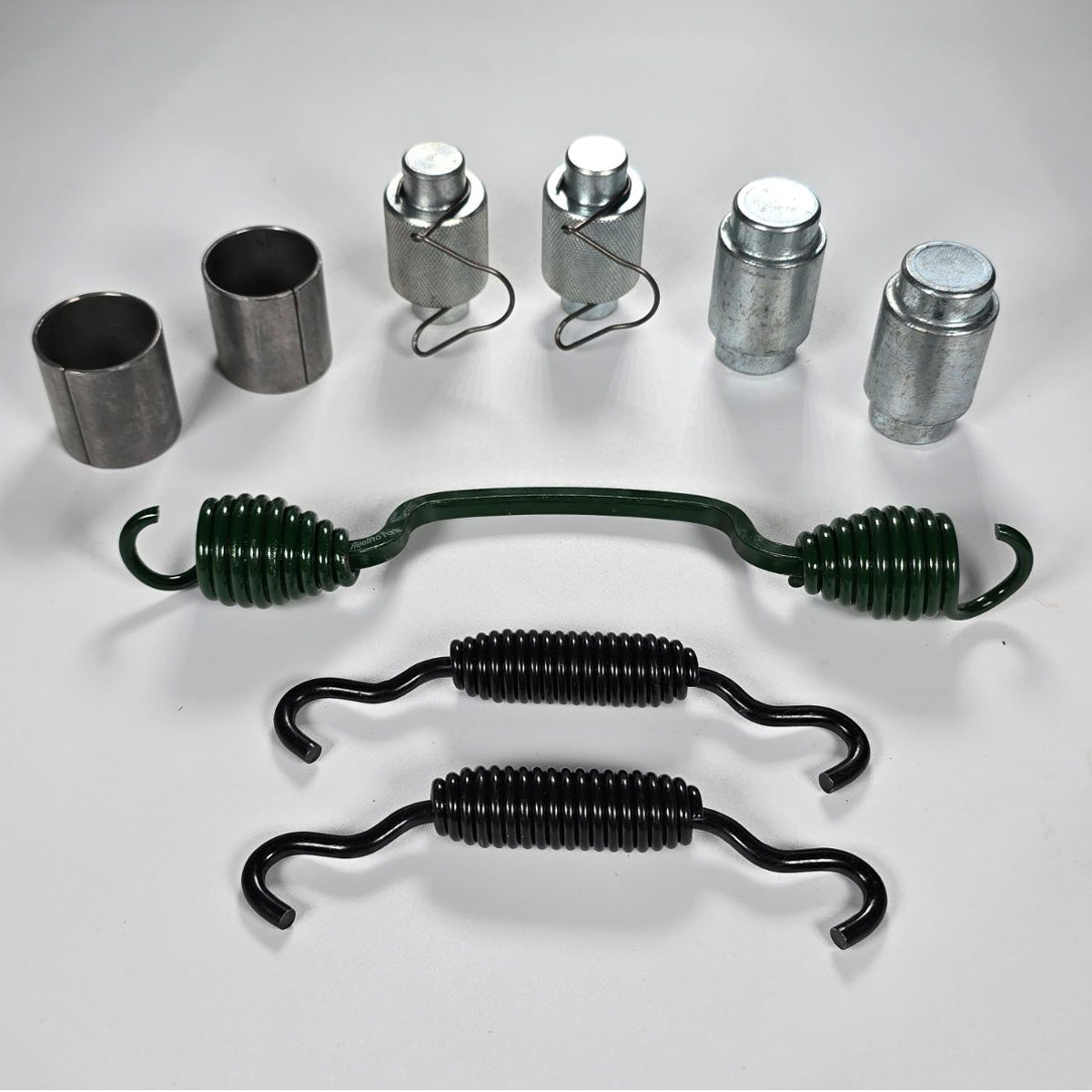 Components of OTR4524QM hardware kit laid out (springs, rollers, pins)