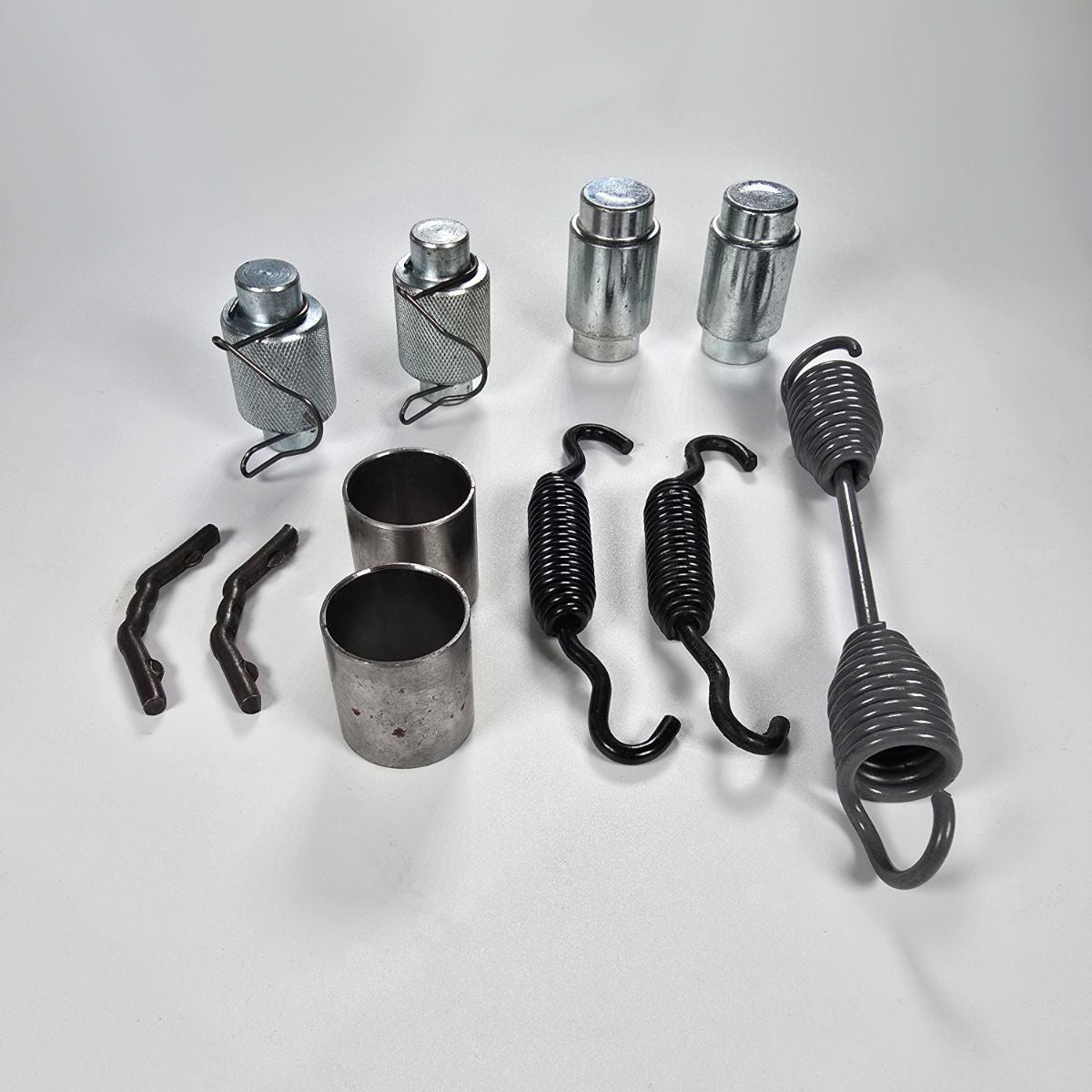 Components of OTR4702 hardware kit laid out (springs, pins, clips)