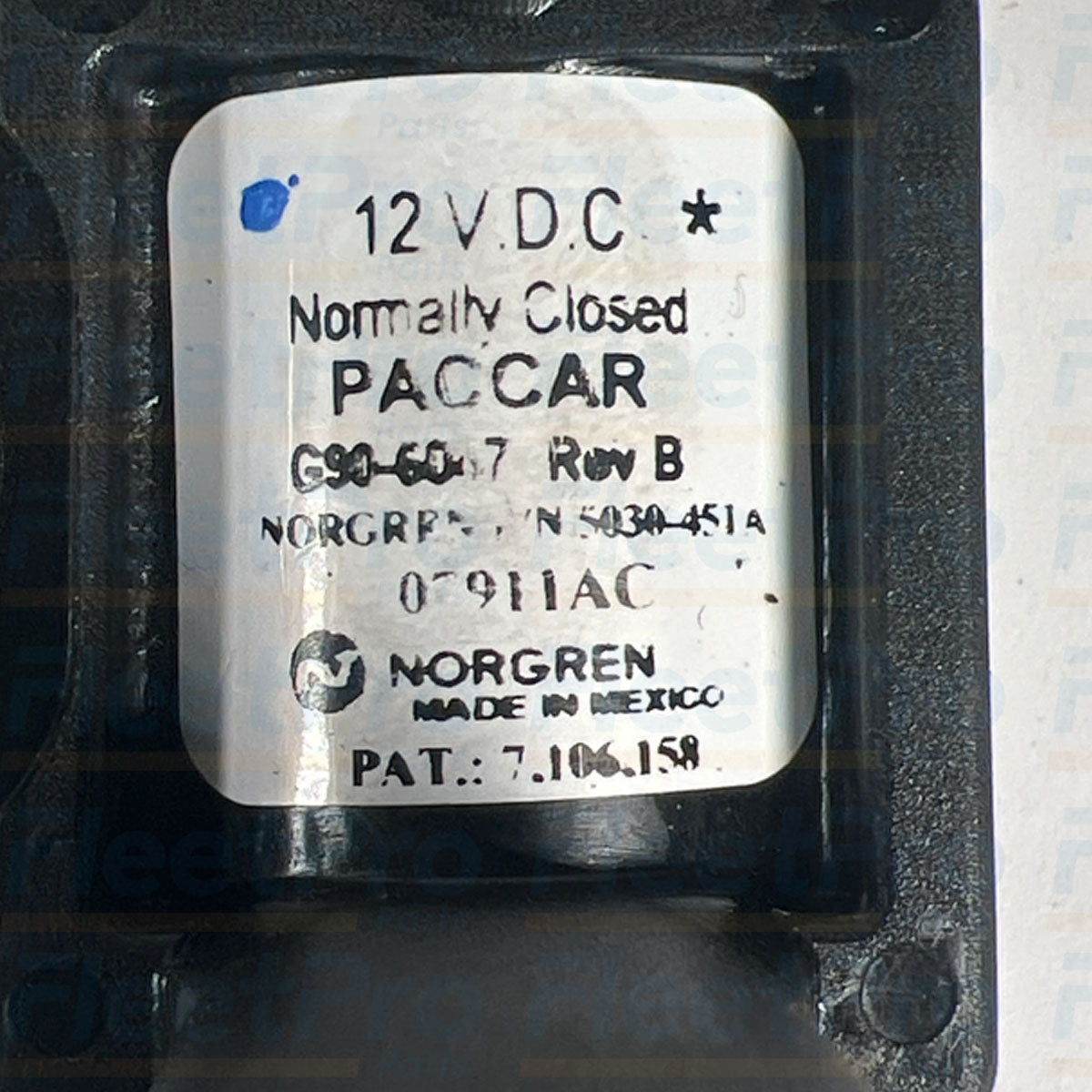 Threaded pneumatic air ports detail on open box Paccar G90-6047 solenoid valve