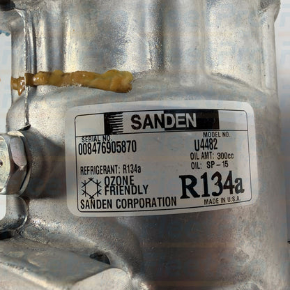 Rear pad mount suction and discharge refrigerant ports detail on Sanden 4482 compressor