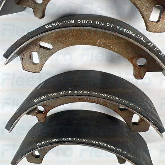 Replacement commercial turf equipment drum brake shoe set Toro part number 84-8600
