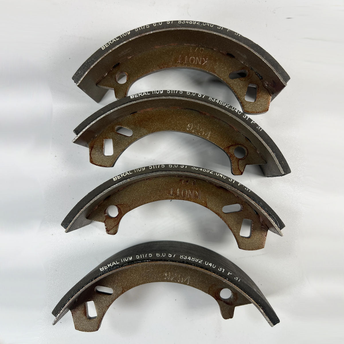 Genuine used OEM Toro 84-8600 lined brake shoes complete set of 4 full front view