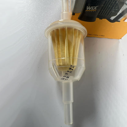 Wix 33011 inline fuel filter full front view showing clear housing and pleated media
